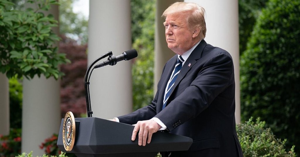 Trump standing at a podium