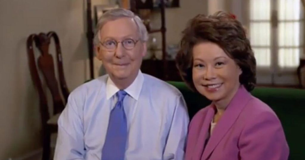A photograph of Mitch McConnell sitting with his wife Elaine Chao
