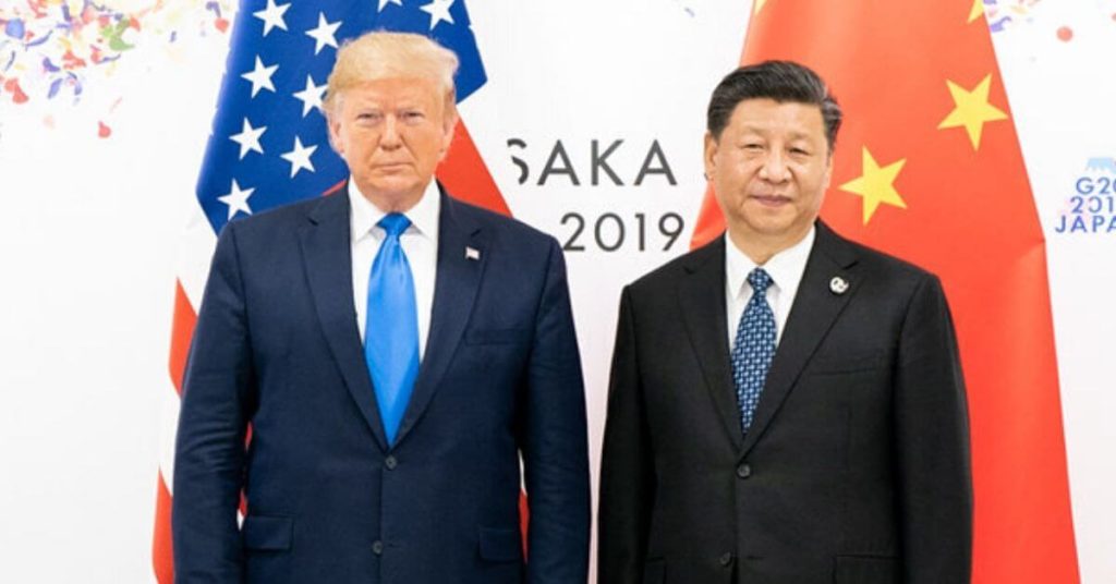 President Trump standing nest to Xi Jinping
