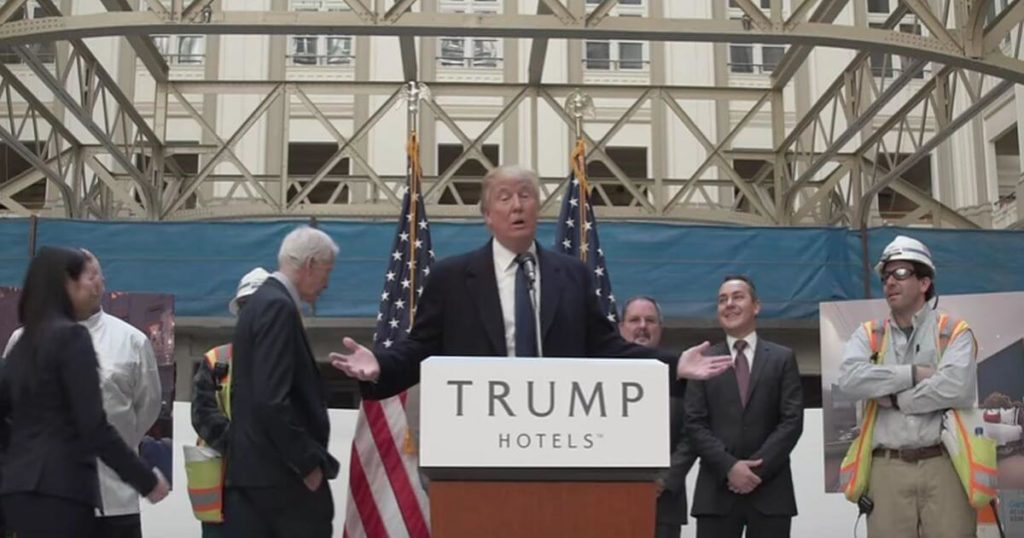 Trump standing at a podium