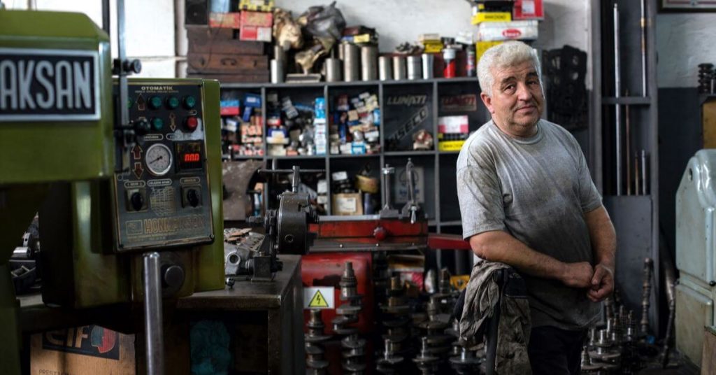 Man standing in a mechanic shop