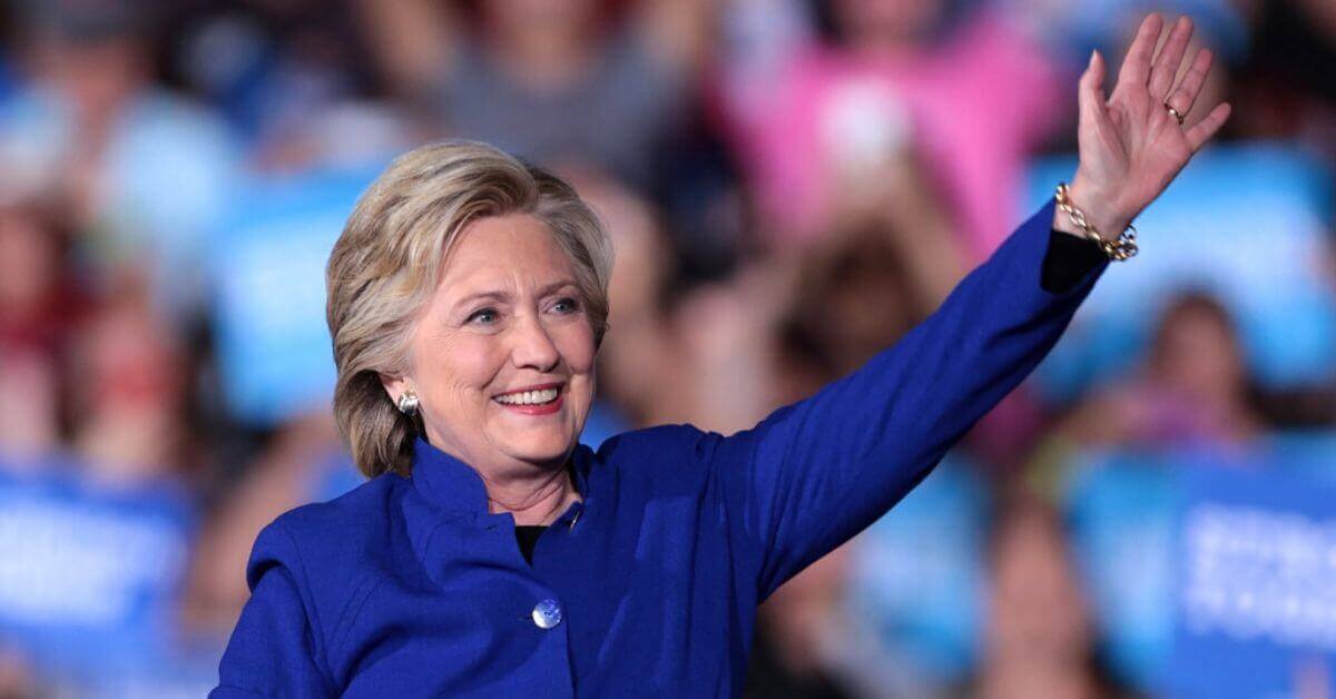 A photograph of Hilary Clinton waving to supporters.