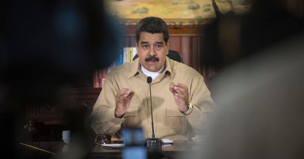 Maduro speaking into a microphone