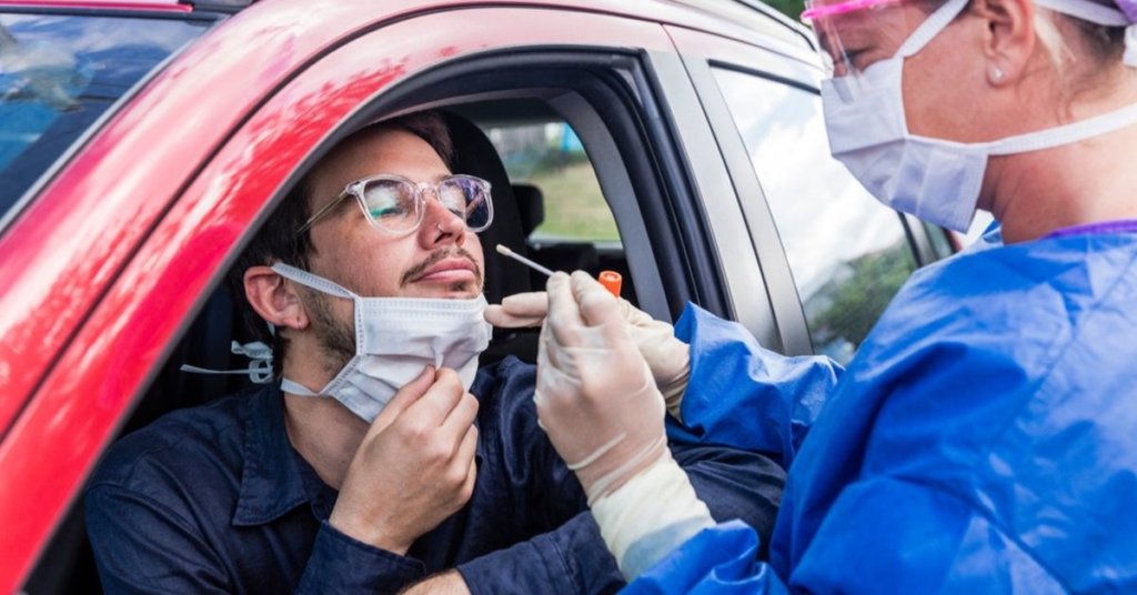 Man getting a coronavirus test in a drive-up facility