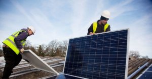 Two men working with solar panels