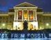 descriptive image of divest from fossil fuels illuminated signage