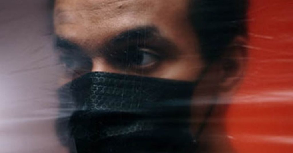 Man wearing a black facemask