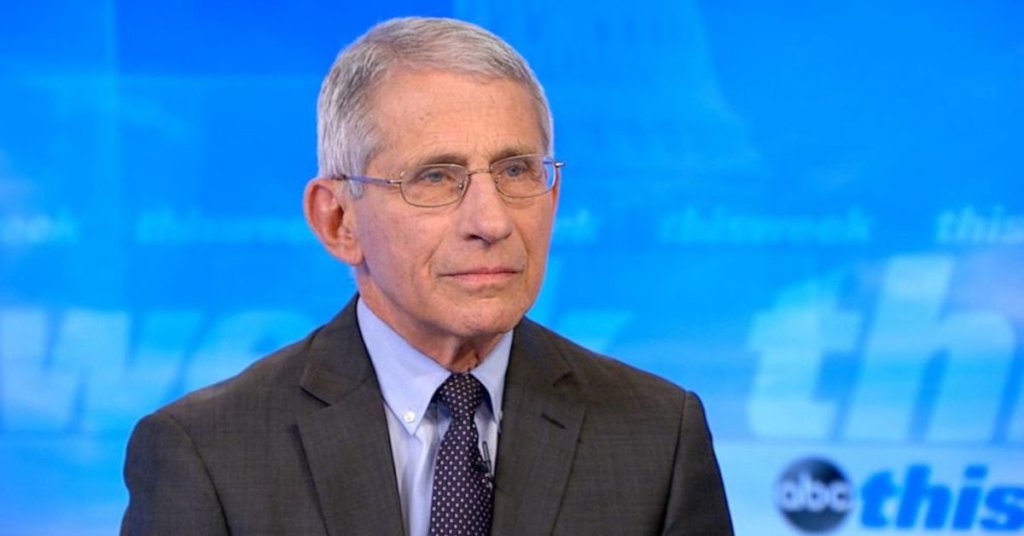 Dr. Fauci in front of a blue background
