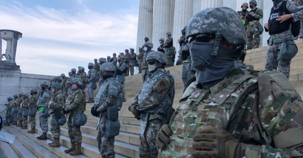 A photograph of National Guard troops blocking access to the Lincoln Memorial.