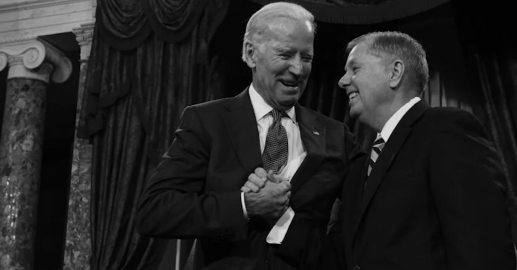 Lindsey Graham and Joe Biden clasping hands