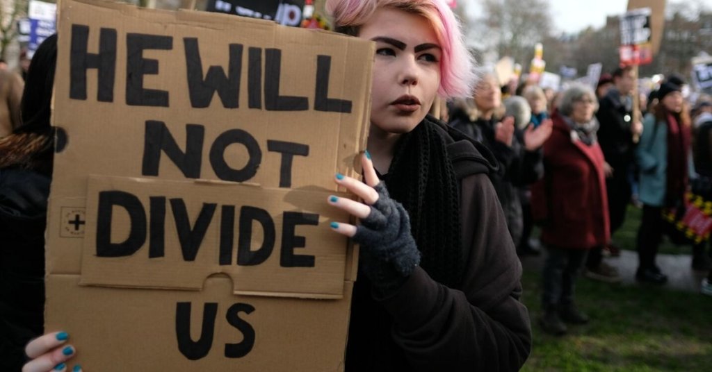 Woman with pink hair at an anti-Trump demonstration