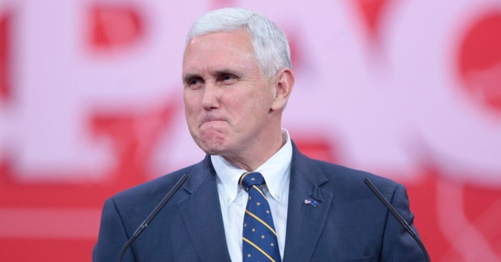 Pence making a grimacing face
