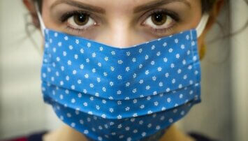 Woman wearing a blue cloth face mask