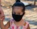 Little girl in a face mask