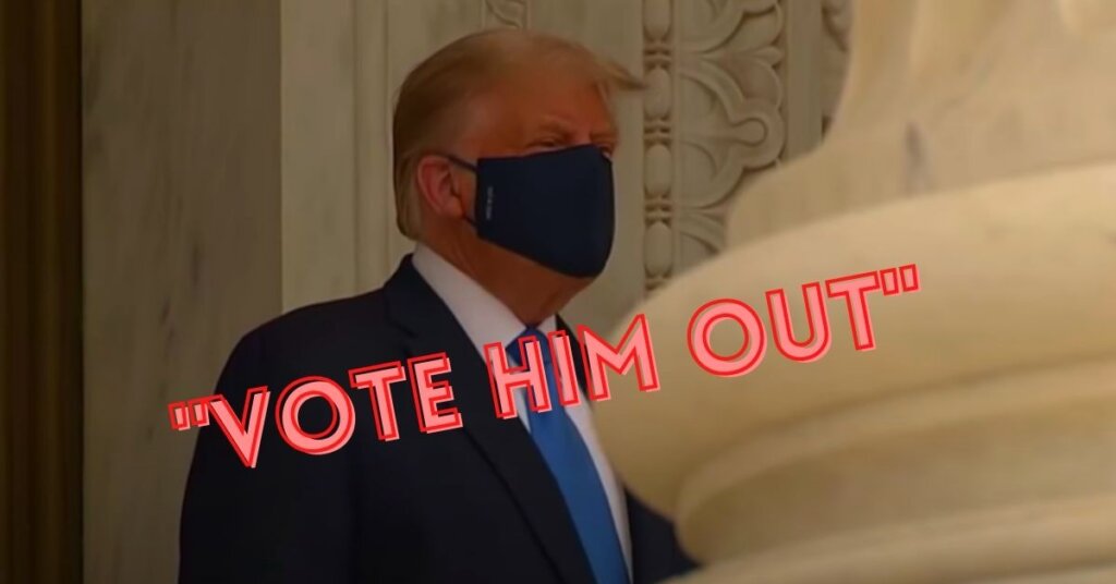Trump wearing a facemask with the words 'vote him out' printed across
