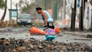 A woman walking across the street in Puerto Rico