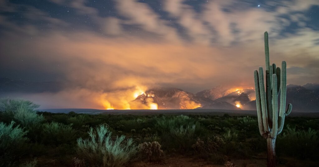 Fires burn in the distance in the Tucson heat
