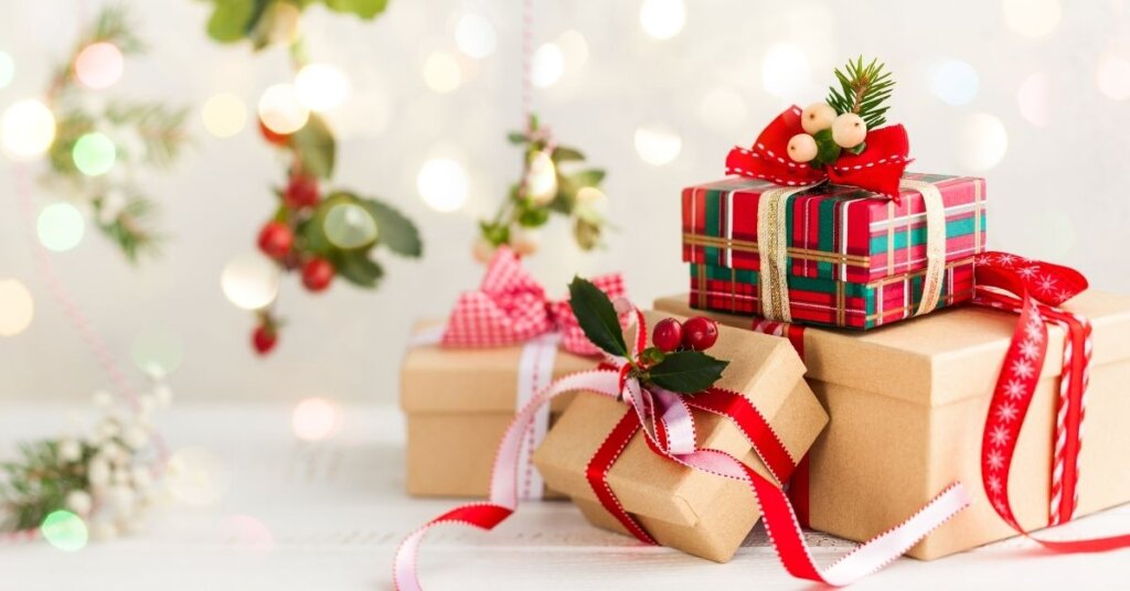Christmas presents stacked up on a white counter