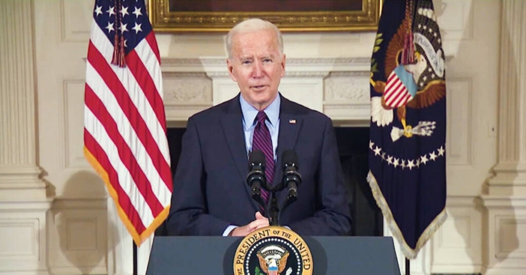 Biden standing at a podium