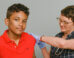 Youth receiving a vaccine