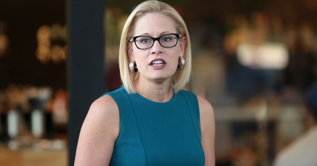 U.S. Congresswoman Kyrsten Sinema speaking with supporters at a neighborhood canvas hosted by the Arizona Education Association at Provision Coffee Arcadia in Phoenix, Arizona.